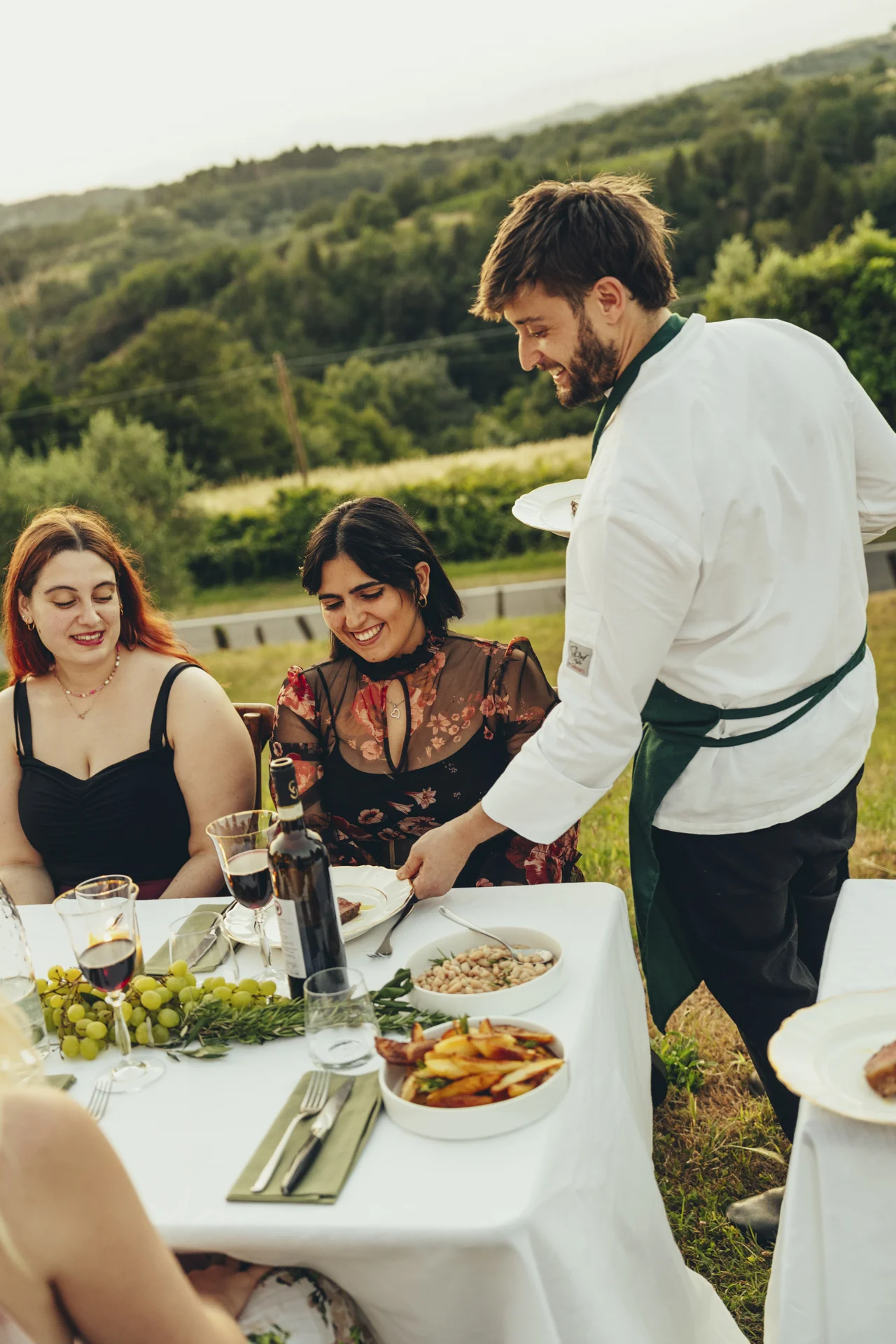 chef serving plates to guests