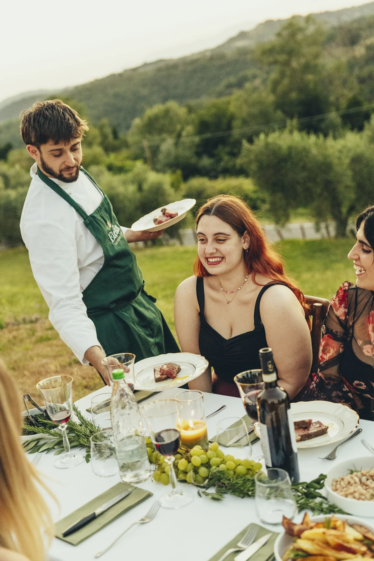 chef serving plates to guests