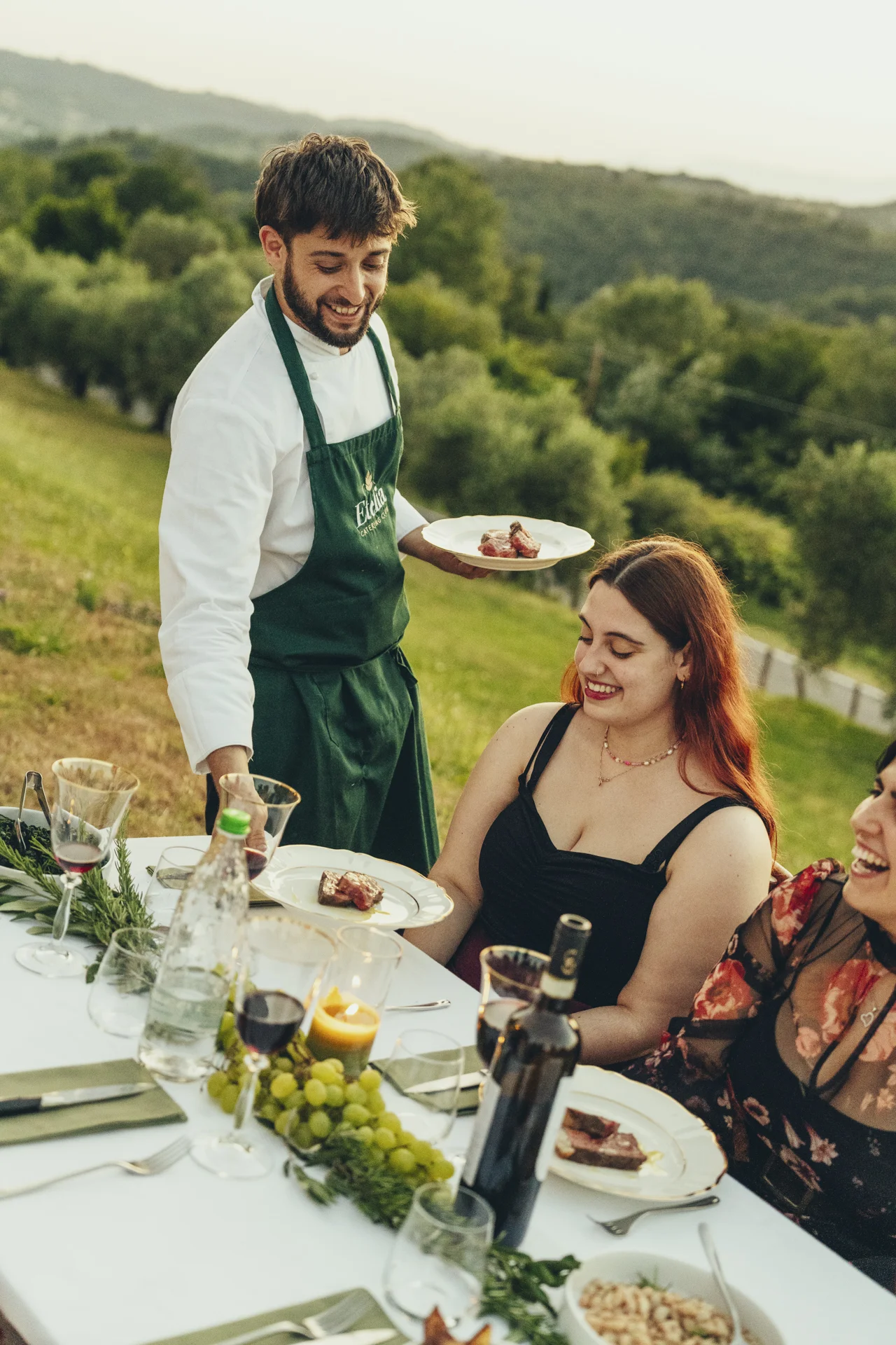 chef serving plates to guests