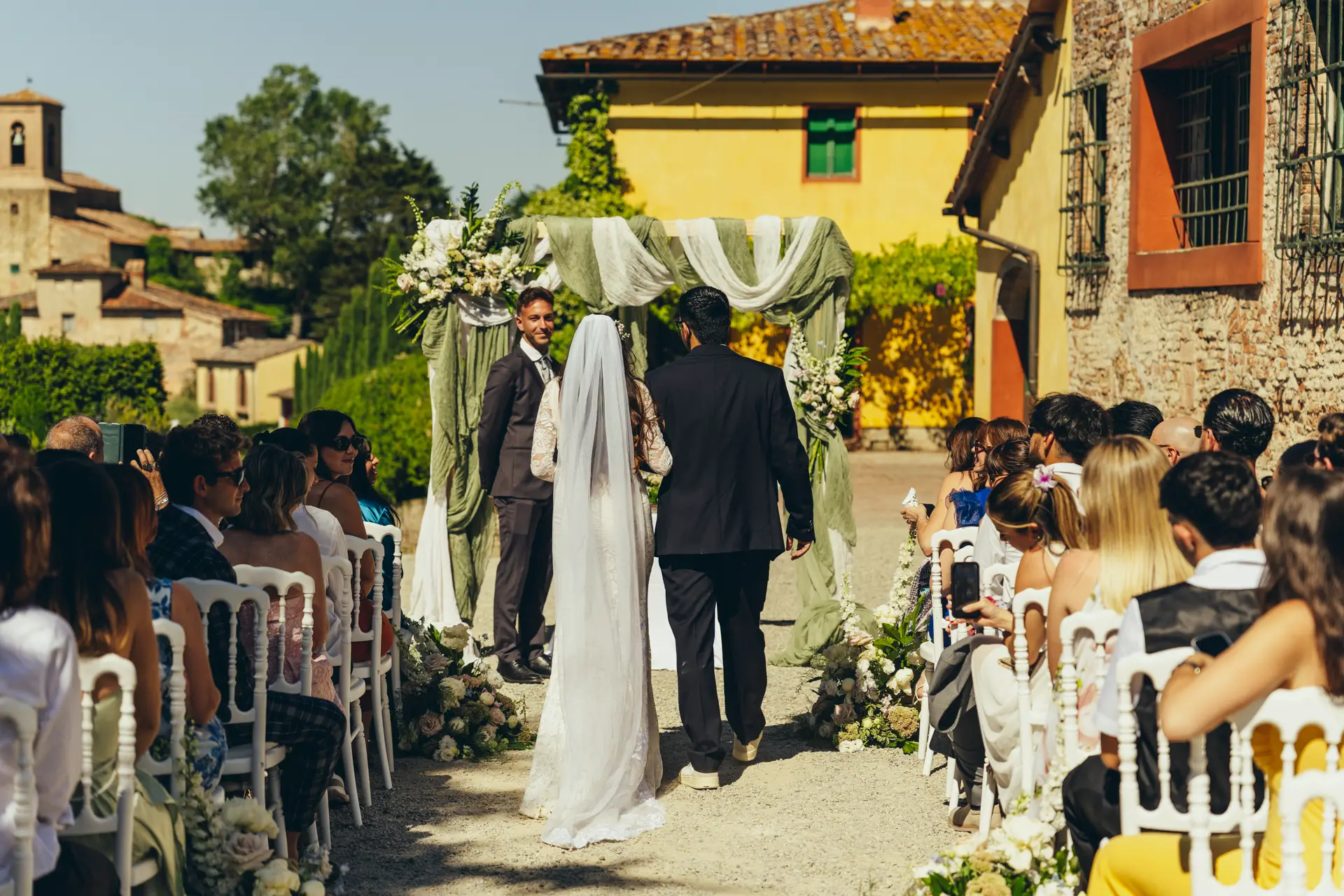 Bride walking toward the groom during the ceremony