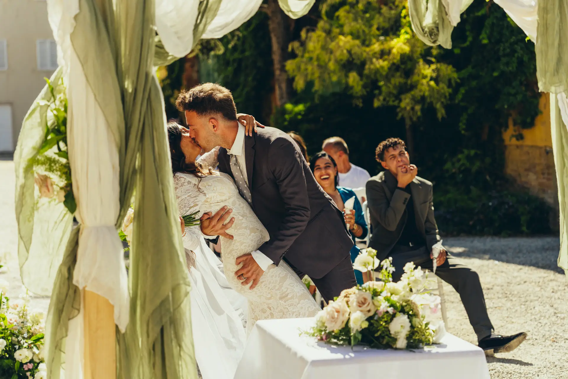 Groom kissing the bride during the ceremony