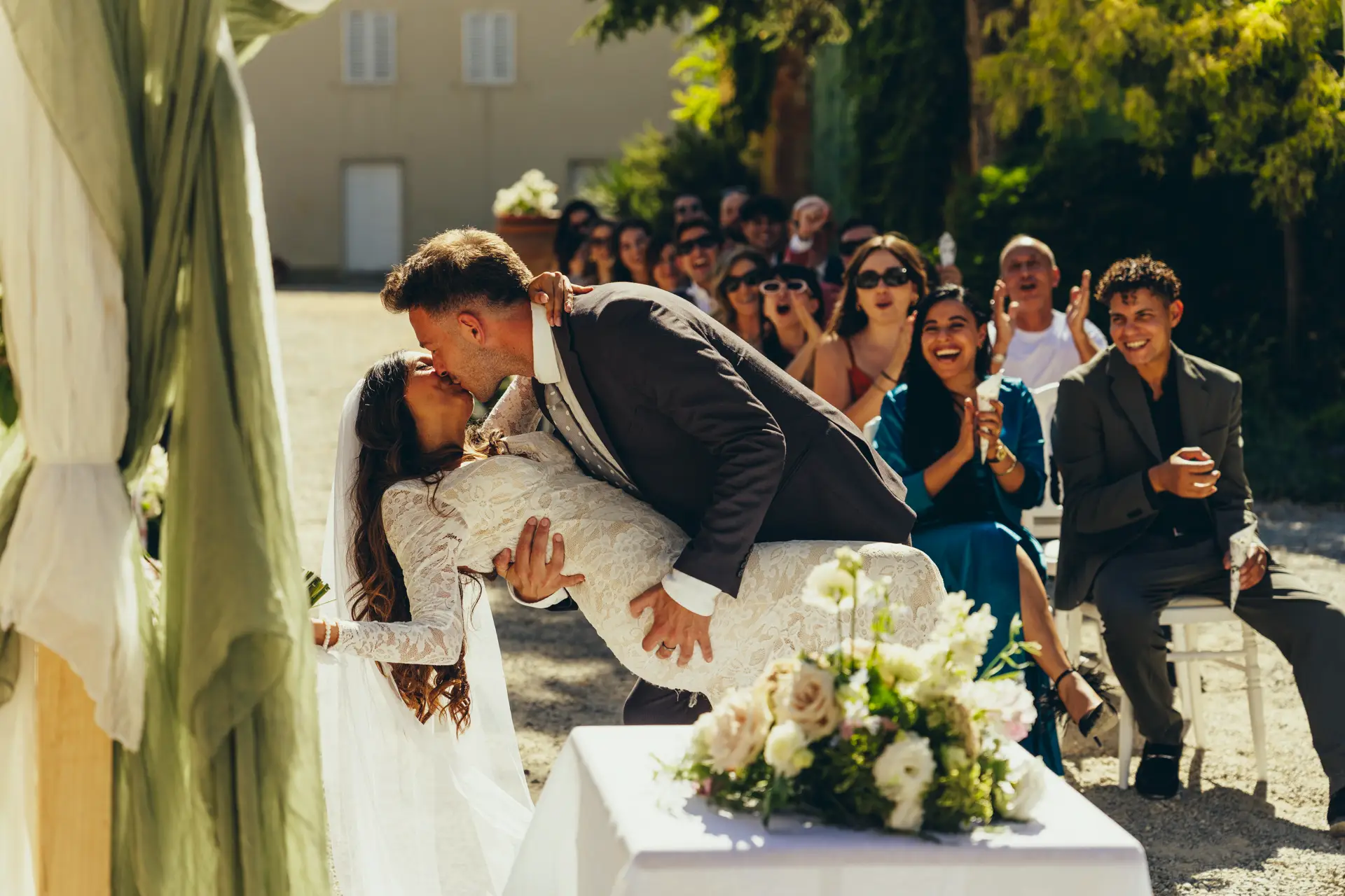 Groom kissing the bride during the ceremony