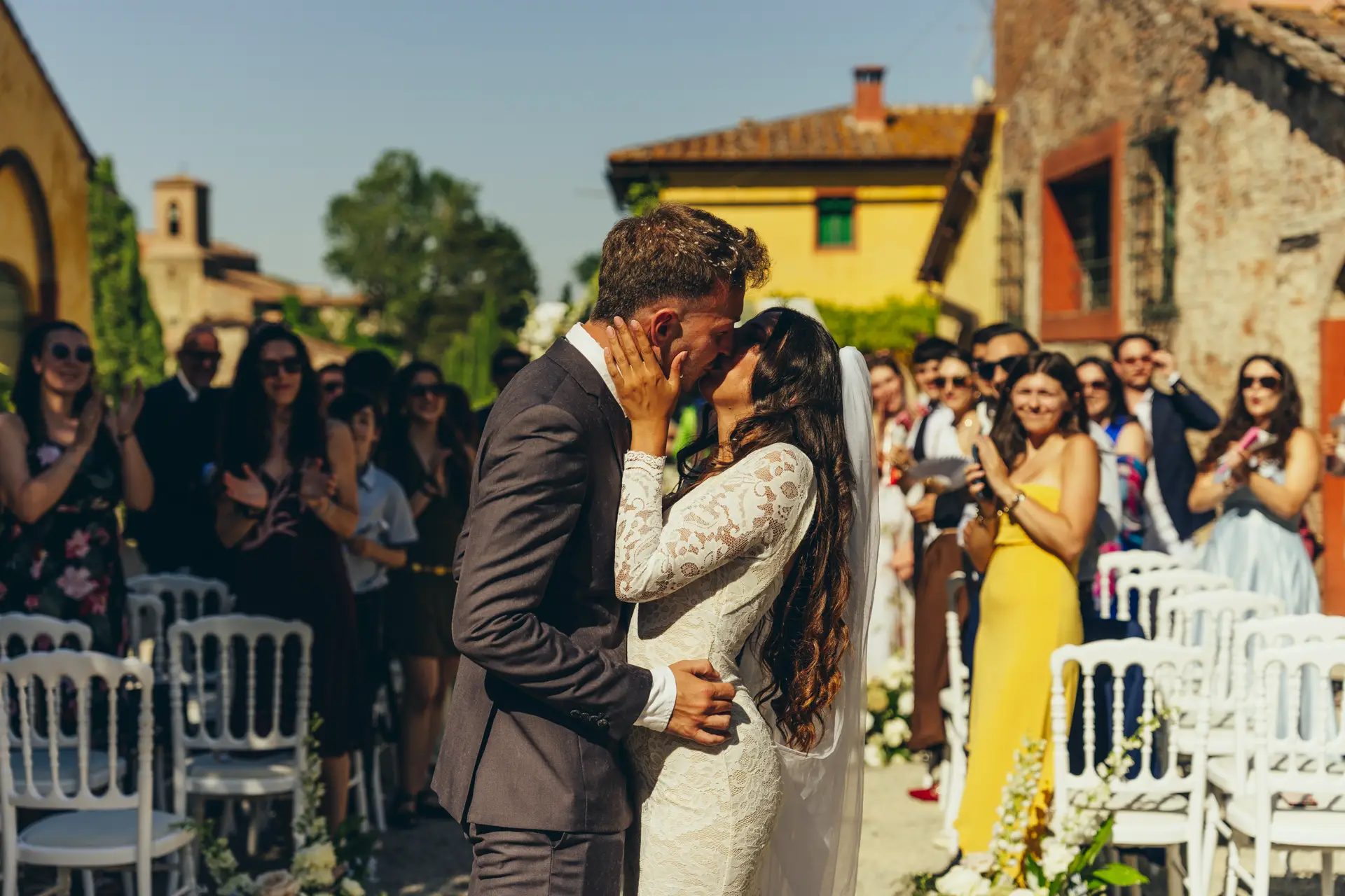 Groom kissing the bride during the ceremony