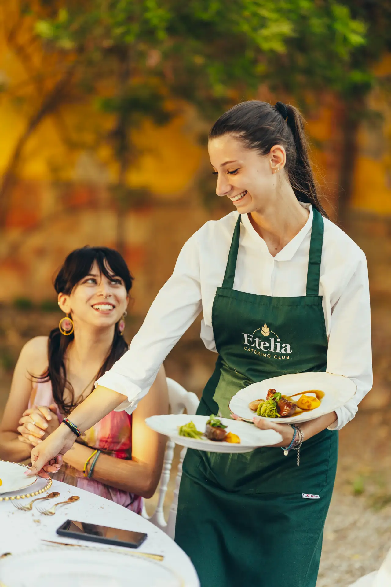 Waitress bringing a plate to the table