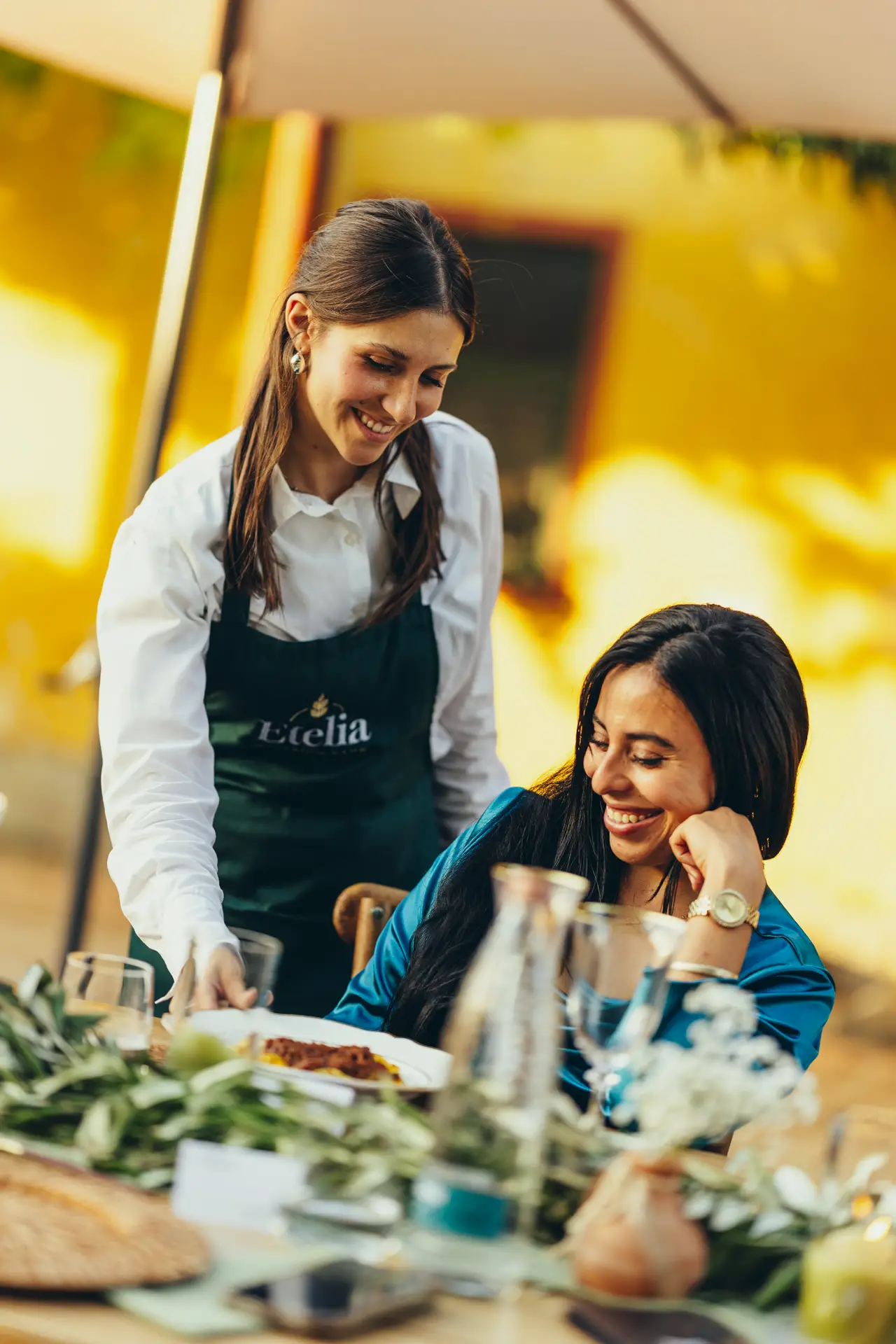 Waitress bringing a plate to the table